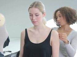 Fashion Designer measuring model in studio Stock Footage