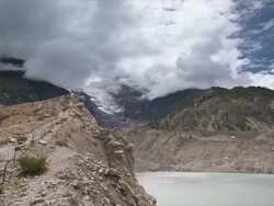 T/L with camera move, cloud over Manang Glacier and Lake, Himalayas Stock Footage