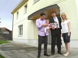 HD CRANE: Family Posing In Front Of Their New Home Stock Footage