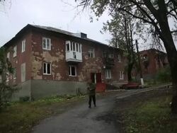 War Devastation in Eastern Ukraine - Semyonovka - exploded ordinance - destroyed apartment building Stock Footage