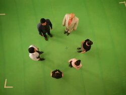 Business people forming alphabet Q Stock Footage