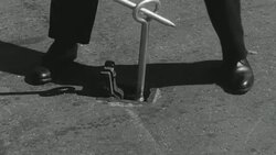 1948 MONTAGE Metropolitan Water Board turncock turning off water supply to broken pipe and inspecting source of water waste / London, England Stock Footage