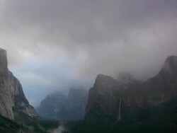 TL, Winter storm clouds in valley, looking at El Capitan & Bridalveil Fall, storm envelopes valley, Yosemite Valley in Yosemite National Park, California Stock Footage