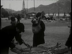 1930 B/W MONTAGE MS chinese men and woman work  unloading cargo from boats, people buying and eating food at outdoor kitchens and food vendors / Hong Kong
 Stock Footage