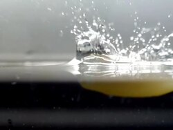 CU SLO MO Shot of Egg yolk falling into water / Seoul, South Korea Stock Footage
