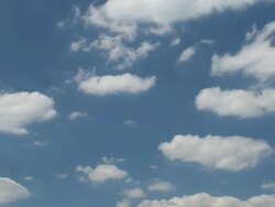 T/L white clouds in blue sky Stock Footage