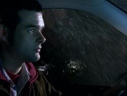 CU Shot of Man driving car in rain, Looking despondent / New York, United States Stock Footage