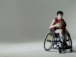 Boy playing wheelchair basketball Stock Footage