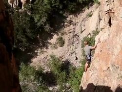 Handheld shot of a rock-climber's hesitation. Stock Footage