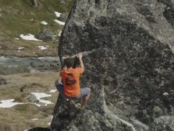 MS TS Shot of climber going up boulder in alpine with stream in backdrop / Anchorage, Alaska, United States Stock Footage