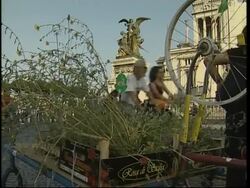 Cyclists block traffic in green protest, passing landmarks News Clip