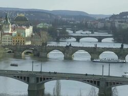 WS People and traffic flowing on bridges over river / Prague, Hlavni mesto Praha, Czech Republic  Stock Footage