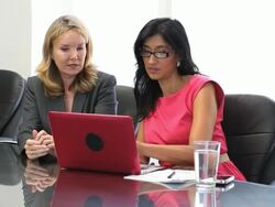 Businesswomen working in conference room Stock Footage