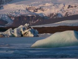 MS View of sunrise glow illuminate the glaciers and snow covered mountain / Iceland Stock Footage