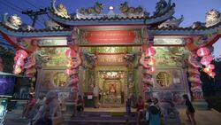 People sitting in front of chinese temple at night Stock Footage