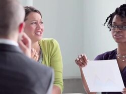 MS coworkers discussing project in office conference room Stock Footage