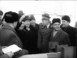 B/W 1961 Nikita Khrushchev waving from crowd outdoors / East Berlin / Cold War / Germany Stock Footage