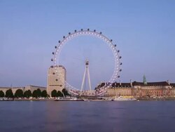 T/L London Eye from Embankment at dusk, with zoom in, London, England Stock Footage