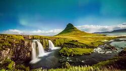 T/L Aurora Borealis at Kirkjufellsfoss waterfall Stock Footage