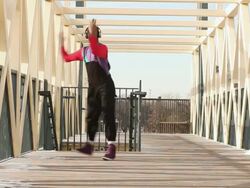 MS Shot of young man dancing on bridge in urban area / Minneapolis, Minnesota, United States Stock Footage