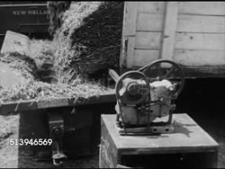 1950s: HAY BARN: VS Motor spinning for conveyor belt, hay being moved on conveyor belt w/ mower, tube leading into side of hay barn. Agriculture, farm, farmland, storage, fodder, forage, food preservation Instructional Video