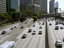 Static slow motion view of traffic on the freeway from bridge in Los Angeles. Stock Footage