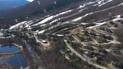 Melting snow covers ski slopes in New Hampshire. Stock Footage
