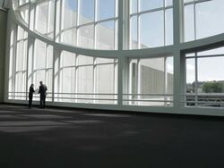  WS Business associates looking out big entry window, looking at blue prints and shaking hands / Seattle, Washington, United States Stock Footage