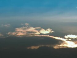 Rising Sun behind the Clouds "timelapse HD" Stock Footage