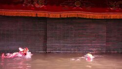 Golden Dragon Water Puppet dancing on water in Hanoi, Vietnam Stock Footage