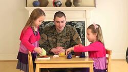 Military Father Playing with His Young Daughters Stock Footage