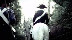 Soldiers in French Revolution uniforms follow a military leader on a white horse. Stock Footage