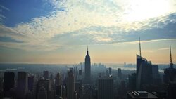 Sunbeams play across the sky above the New York City skyline. Stock Footage