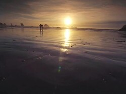 MS SLO MO POV Couple walking on Beach at sunset / Bandon, Oregon, United States Stock Footage