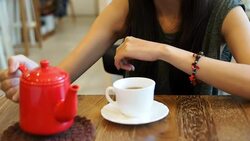 Young woman drinking hot tea Stock Footage