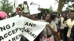 CLEAN : Rwandan protestors demand British free arrested spy chief News Clip
