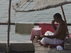 WS Man meditating at Ganges river / Varanasi, India Stock Footage
