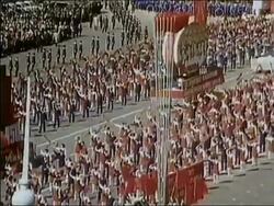 1972 high angle zoom out parade through Red Square with marchers, flags and floats / Moscow, USSR Stock Footage