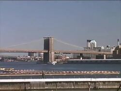 NYC: Brooklyn Bridge from Battery Park Docks / Piers (Push/Pull) Stock Footage