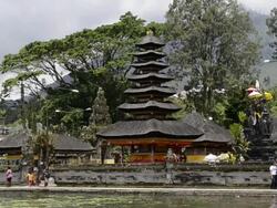 MS Shot of Pura Ulun Danu temple at Lake Bratan and people roaming near temple / Bedugul, Bali, Indonesia   Stock Footage