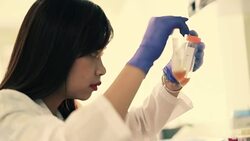 Scientist a look at test tube with liquid sample in laboratory, Slow motion Stock Footage