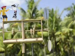 CU Klopotec (Pinjekan) from bamboo, wind-rattle used as scarecrow in paddy field / Ubud, Bali, Indonesia Stock Footage