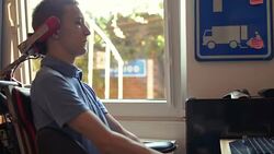 Disabled young man using computer Stock Footage