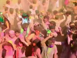 Group of people playing holi and dancing, Delhi, India Stock Footage