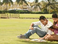 Young couple studying in a park Stock Footage