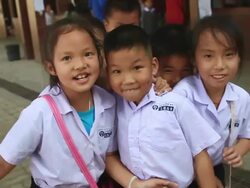 MS SLO MO POV Children standing laughing at schoolyard / Vientiane, Laos Stock Footage