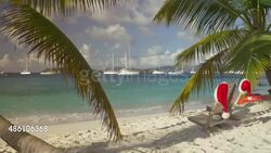 video of chairs with Santa hats at a tropical beach Stock Footage