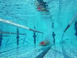 HD Super Slow-Mo: Young Woman Starting Breaststroke Race Stock Footage