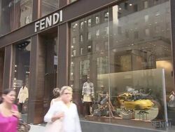 MS, Pedestrians passing by Fendi store window display, New York City, New York, USA Stock Footage