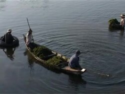Angkor Wat, Cambodian workers in canoes Stock Footage